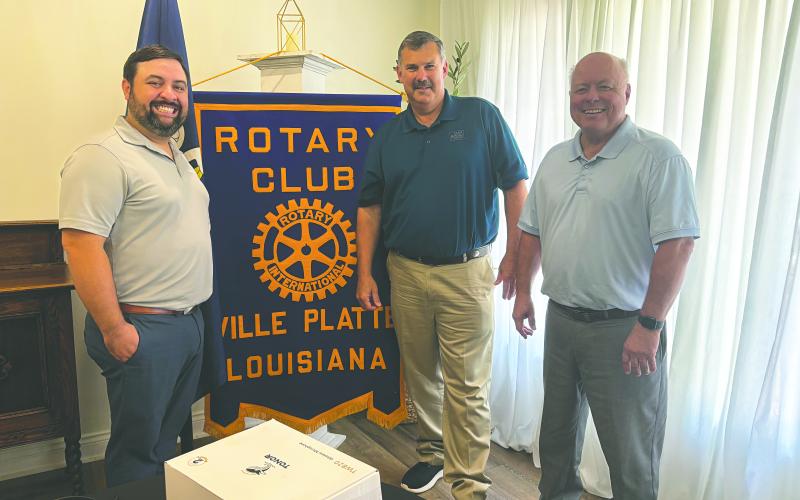 STATE OF AGRICULTURE DISCUSSED - Farm Bureau President Richard Fontenot discussed agriculture during the July 29, meeting of the Ville Platte Rotary Club. He is shown with Rotary President Beau Wilson (left) and Rotarian Dr. Hosea “Joey” Soileau (right). (Gazette photo by Heather Bogard)