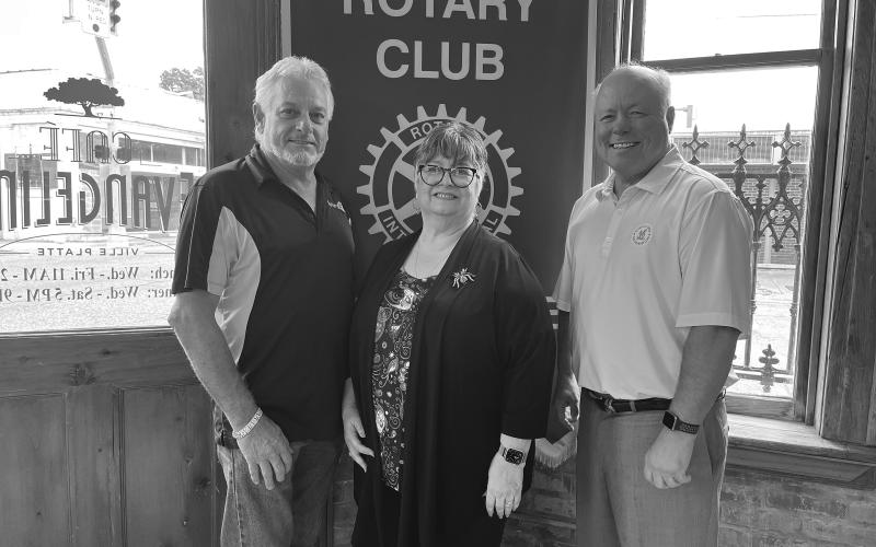 UNITED WAY UPDATE GIVEN - St. Landry-Evangeline United Way Executive Director Ginger LeCompte (center) addressed the August 9, meeting of the Ville Platte Rotary Club. She is shown with Rotary President Larry Lachney (left) and Rotarian Dr. Hosea “Joey” Soileau (right). (Gazette photo by Heather Bogard)
