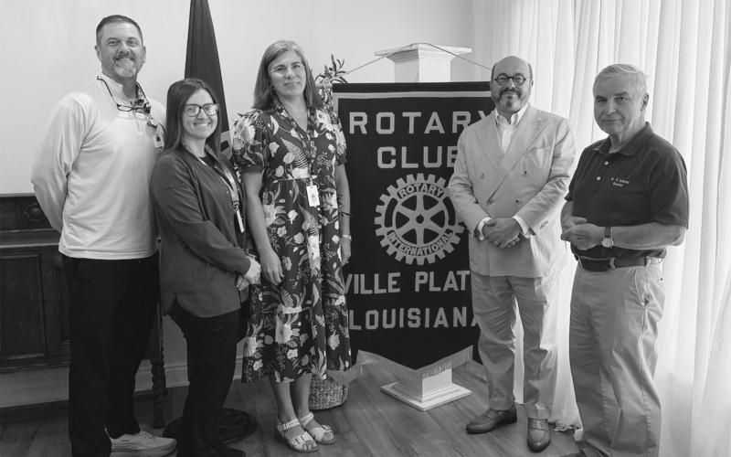 DR. MINACHE VISITS VP ROTARY - Dr. Lawrence Minache visited the Tuesday, August 11, meeting of the Ville Platte Rotary Club. Shown, from left, are radiation therapists Korey Credeur and Christy Waldmann, Angela Fontenot (marketing director at Savoy Medica Center), Dr. Minache and Rotary President Dr. Kirk Soileau (right). (Gazette photo by Heather Bogard)