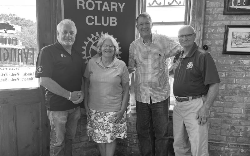 NORMAND DISCUSSES ROTARY FOUNDATION - Yvonne Normand, former district governor, second from left, addressed the August 16, meeting of the Ville Platte Rotary Club. She is shown with, from left, Rotary President Larry Lachney, Rotarian Philippe Vidrine and Normand’s husband, Keith, who is also a fellow Rotarian. (Gazette photo by Heather Bogard)