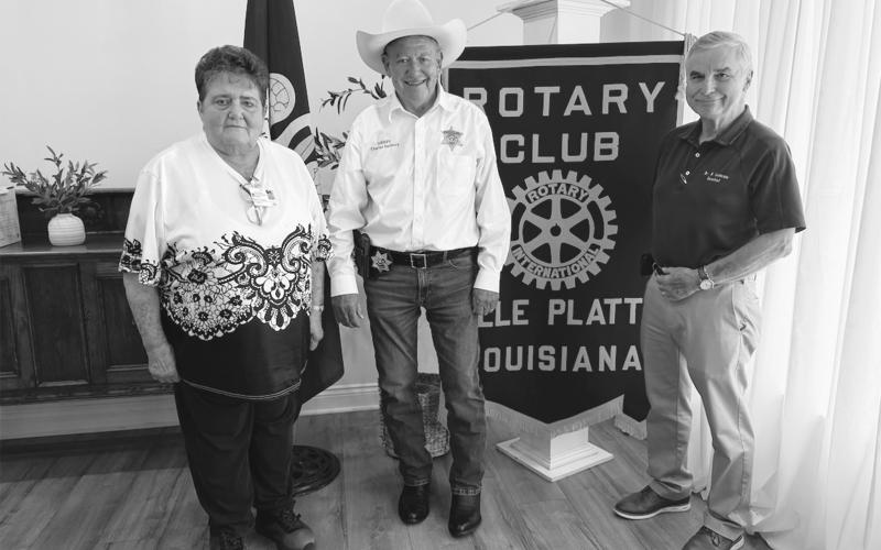 SHERIFF VISITS VP ROTARY - Evangeline Parish Sheriff Charles Guillory (center) visited the Tuesday, August 18, meeting of the Ville Platte Rotary Club. He is shown with Rotarian Mable Foreman (left) and Rotary President Dr. Kirk Soileau (right). (Gazette photo by Heather Bogard)