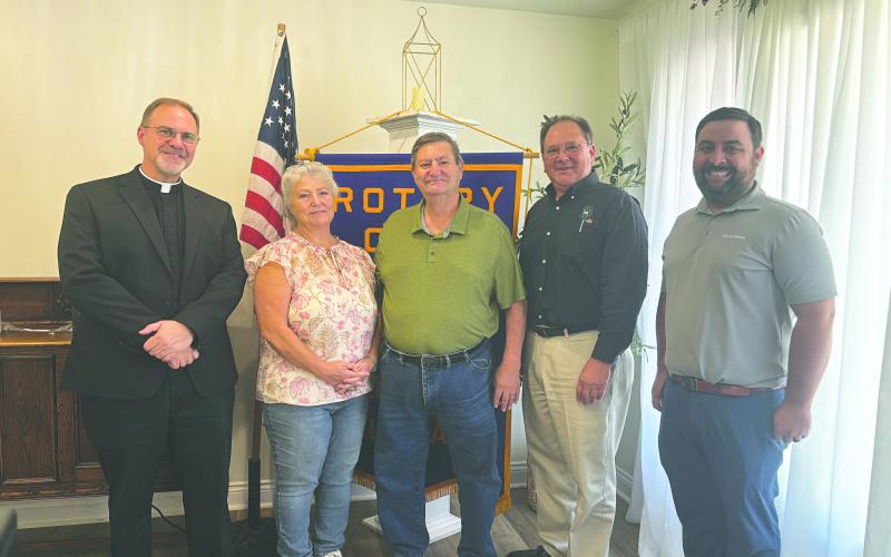 HISTORY OF VILLE PLATTE ROTARY CLUB SHARED - Shown, from left, are honorary Rotarians Father Mitchell Guidry, Darlene Bolfa and Ray Duplechain, Rotarian Wayne Vidrine and Rotary President Beau Wilson. Vidrine shared a brief history of the club during the August 26 meeting. (Gazette photo by Heather Bogard)