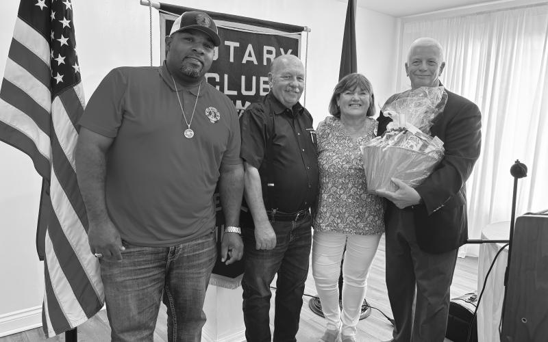 DISTRICT GOVERNOR VISITS -  Rotary District Governor Craig Walling (right) was the special guest speaker for the August 27, meeting of the Ville Platte Rotary Club. He is shown with, from left, Ville Platte Mayor and Rotarian Ryan LeDay Williams, Rotary President Bob Manuel and his wife, Clara Walling. (Gazette photo by Heather Bogard)