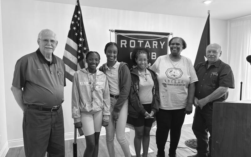 INTERACT CLUB PLANS COMMUNITY INVOLVEMENT -  Rotarian Linda Fontenot invited Ville Platte Interact students to share plans for their new and growing club. Shown, from left, are Rotarian Kermit Miller, Nyla Guillory (vice president), Zaleria Calvin (president), Gustavia Sanchez (treasurer), Fontenot and Rotary President Bob Manuel. (Gazette photo by Heather Bogard)