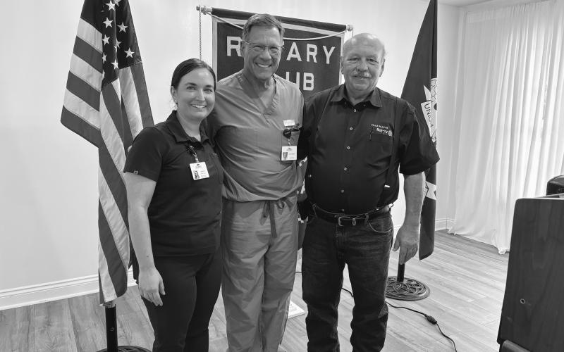CARDIOLOGIST SHARES HEALTH CARE TIPS -  Cardiologist Dr. Craig Pearce addressed the September 17, meeting of the Ville Platte Rotary Club. He is shown with Rotarian Ashlyn Ortego (left) and Rotary President Bob Manuel (right). (Gazette photo by Heather Bogard)