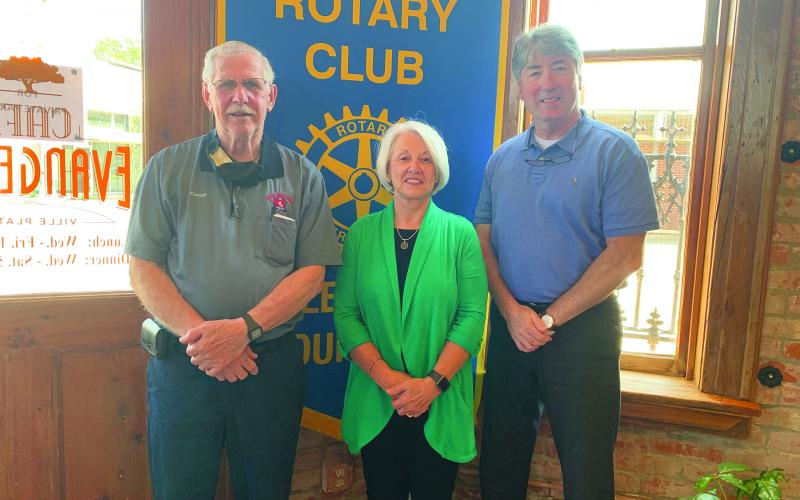 VP ROTARY WELCOMES DR. FONTENOT - Dr. Gwen Fontenot, president of the Evangeline Parish Chamber of Commerce, center, was the guest speaker for the September 21, meeting of the Ville Platte Rotary Club. She is shown with Rotarian Kermit Miller, left, and Rotary President Jimmy LeBlanc, right. (Gazette photo by Heather Bogard)