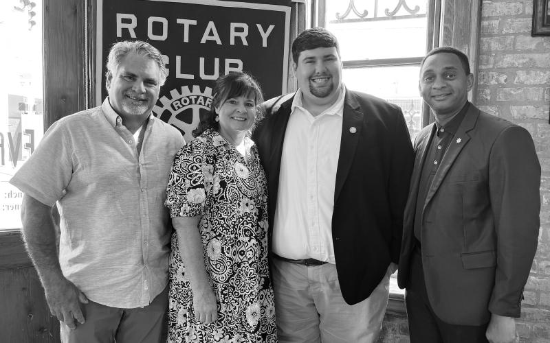 GIL SHARES COLLEGE EXPERIENCE - Sam Gil, son of Rotarian Eric Gil and Nicole Gil, shared his experience as a student at McNeese State University and his involvement with student government on a campus and state level. From left, are Eric, Nicole and Sam Gil with Rotary President Brian Ardoin. (Gazette photo by Heather Bogard)