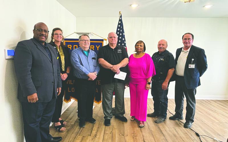 EVANGELINE REIMAGINE ACADEMY OVERVIEW GIVEN - Evangeline Parish School Board President Bobby Max Hamlin, along with Principal Alice LeJeune, gave an update on Evangeline Reimagine Academy during the October 1, meeting of the Ville Platte Rotary Club. Shown, from left, are Superintendent Darwan Lazard, LeJeune, Rotarian Dan Poret, Hamlin, Title One Supervisor Grace Sibley, Rotary President Bob Manuel and Assistant Superintendent Mike Lombas. (Gazette photo by Heather Bogard)