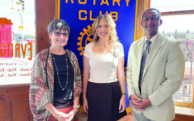 CALHOUN TALKS COTTON FESTIVAL - Katelyn Yates Calhoun (center) was the guest speaker for the October 3, meeting of the Ville Platte Rotary Club. She is shown with Rotarian Annette Johnson (left) and Rotary President Brian Ardoin. (Gazette photo by Heather Bogard)