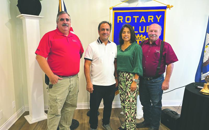 FREEDOM CENTER DISCUSSED - Pastor Steven Sawtelle and his wife, Sarahi, visitied the October 22, meeting of the Ville Platte Rotary Club to talk about their recently opened Freedom Center. Shown, with the couple are Rotarian Scott Smith (left) and Rotary President Bob Manuel (right). (Gazette photo by Heather Bogard)