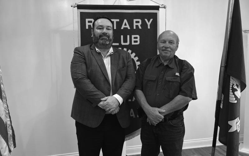 UPDATE ON CRIME GIVEN - Assistant DA Jacob Fusilier (left) addressed the November 19, meeting of the Ville Platte Rotary Club. He is shown with Rotary President Bob Manuel (right). (Gazette photo by Heather Bogard)