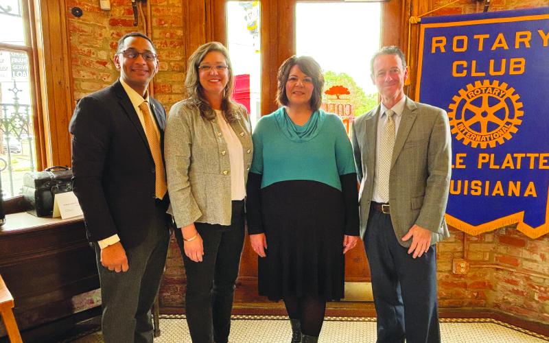 UPDATE GIVEN ON REIMAGINE ACADEMY -  Alice LeJeune and Liz Chatelain with Reimagine Academy addressed the November 21, meeting of the Ville Platte Rotary Club. Shown, from left, are Rotary Club President Brian Ardoin, LeJeune, Chatelain and Rotarian Richard LeJeune. (Gazette photo by Heather Bogard).