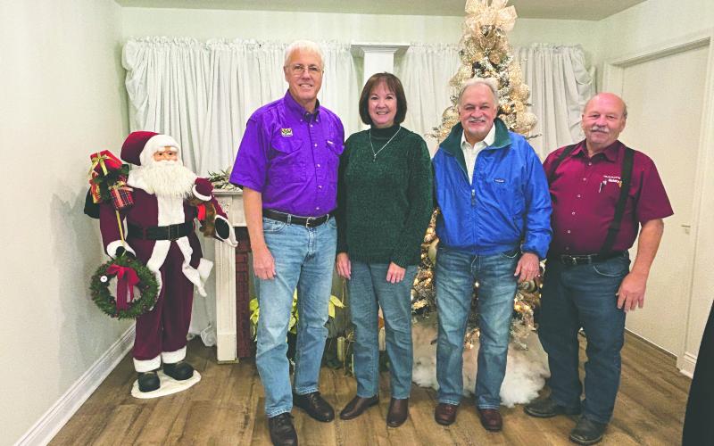 SUCCESSFUL CRAWIFISH SEASON PREDICTED - Mark Shirley visited the December 3, meeting of the Ville Platte Rotary Club to discuss the upcoming crawfish season. From left are Shirley, his wife, Rebecca Shirley, Rotarian Dr. William “Tojo” Ward and Rotary President Bob Manuel. (Gazette photo by Heather Bogard)