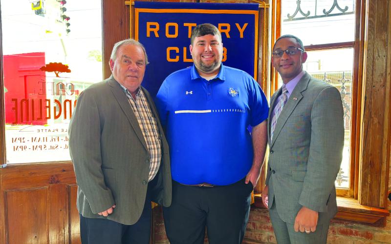 Sam Gil (center) addressed the December 19, meeting of the Ville Platte Rotary Club. He is shown with Rotarian Steve Phillips (left) and Rotary Club President Brian Ardoin. (Gazette photo by Heather Bogard).