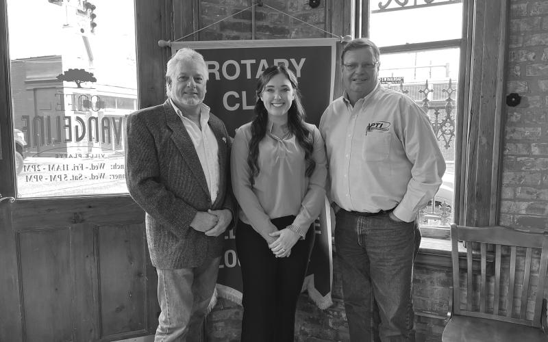 HEBERT DISCUSSES CLINIC SERVICES - During the December 20, meeting of the Ville Platte Rotary Club, Morgan Hebert (center) spoke with the group about services at the new Mercy Regional Clinic. She is shown with Rotary President Larry Lachney (left) and Rotarian Mitch Fontenot (right). (Gazette photo by Heather Bogard)