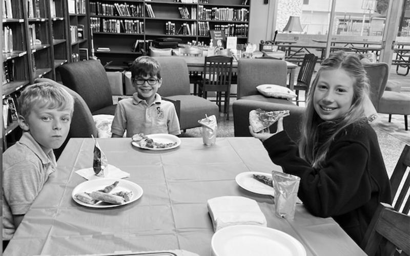From left, are Merritt Deville, Everett Fontenot and Audrey Caulkins. They enjoyed pizza in the library as they were among the top accelerated readers for the first nine weeks. (Photo courtesy of Jan Veillon)