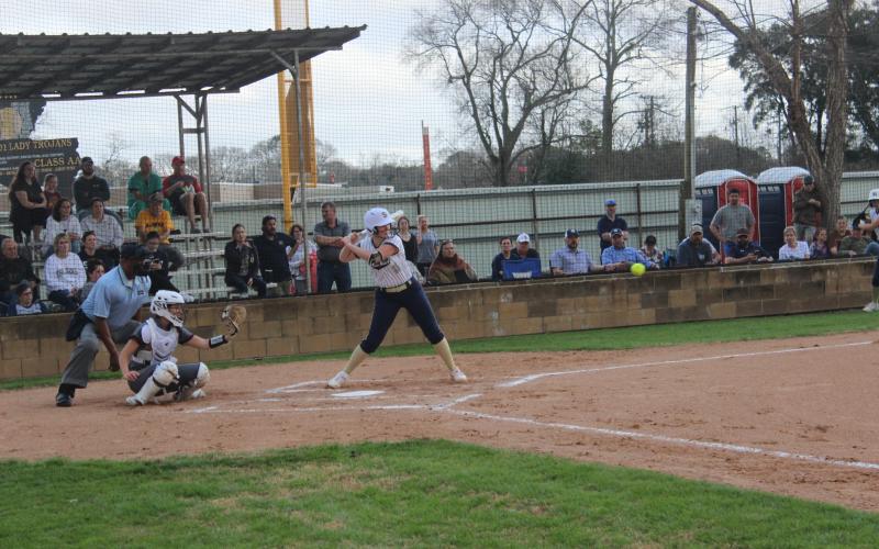 Lady Trojans’ slugger Jolie Vidrine stands ready at the plate in an early season softball game. (Gazette photo by Rhett Manuel)