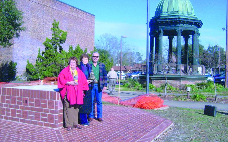 In the right photo, from left, are Camille Fontenot, Mary Alice Fontenot and Gorum standing in the future location of the life-size statue on the grounds of the Evangeline Parish Courthouse. (Gazette file photos)