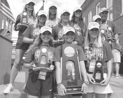 The Ole Miss Women’s Golf Team, with Pine Prairie native Julia Johnson (middle right), show off hardware as they return to Oxford after winning the national championship. It was the first national title in the history of women’s sports for the university. (Photo courtesy of Ole Miss Women’s Golf)