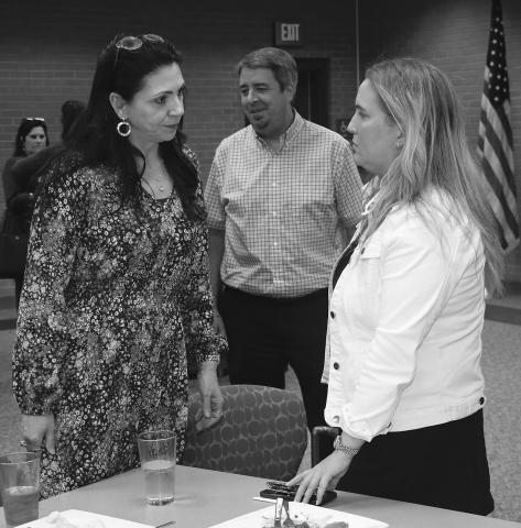 State Rep Julie Emerson, right, talks with St. Landry Parish Assessor Sherri Zeringue McGovern at a recent Eunice Rotary Club meeting. At center is Eunice Mayor Scott Fontenot. Emerson, who heads the House Ways and Means Committee, spoke about tax issues at the meeting held at LSUE. (LSN photo by Harlan Kirgan) 