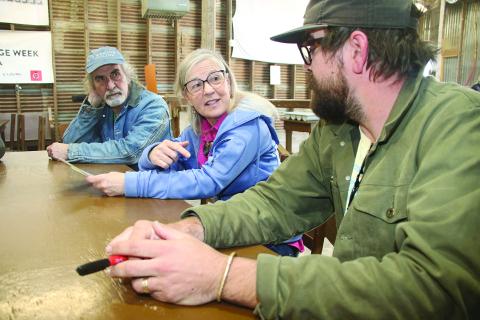 Jeanne Solis, Folk Roots executive director, center, explores questions about culture with from left, Pete Hobbie, of West Virginia, and Jo Vidrine, program and artistic director of Dewey Balfa Cajun and Creole Heritage Week at Lakeview Park & Beach, north of Eunice off La. 13. (LSN photo by Harlan Kirgan)