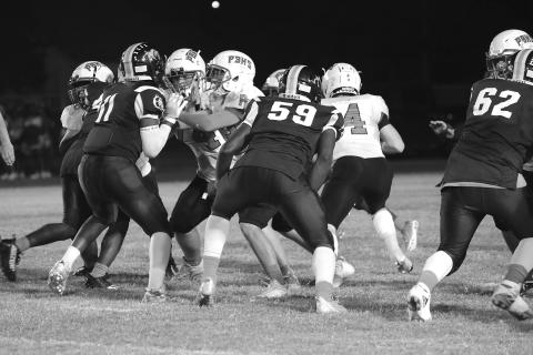 Members of the Ville Platte Bulldog defensive unit held Port Barre to 22 points last week helping the team record its second win of the season. The Bulldogs, tonight, head to Church Point. (Photo courtesy of Susan Angelle Photography)