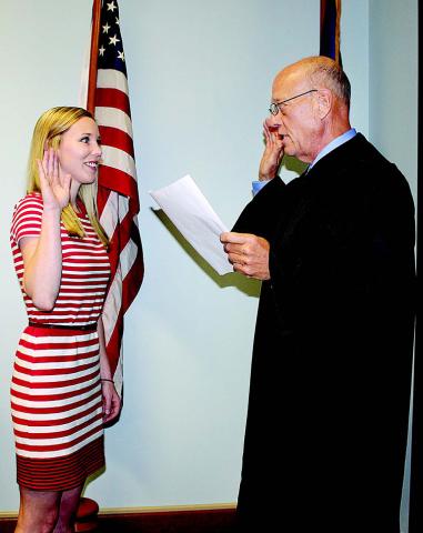 Elizabeth West (left) takes the oath of office from Judge Chuck R. West on Thursday inside West’s courtroom at the Evangeline Parish Courthouse. In 2016, West was first sworn in as a board member of the Acadiana Area Human Services District, which promotes awareness about health issues and overseas health units in seven parishes, including Evangeline Parish. She was reappointed for another term by Governor John Bel Edwards. (Gazette file photo)