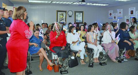 Teacher of the Year Coordinator Grace Sibley (left) leads a chorus of “This Little Light of Mine” during the Evangeline Parish School Board Meeting held Wednesday, June 22. Recognized during the meeting were the current and former teachers or principals of the year who made it to the state level. Seated from left on the front row are Emee Aswell, Lisa Celestine, Kayla Joseph Jones, Heather Demourelle, Christine Bacon, Liz Chatelain, and Cherie Fontenot.