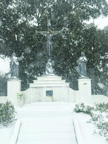 According to reports, a record eight inches of snow blanketed Evangeline Parish. The snowfall amount exceeded the previous record which was set in 1895. In the photo on the left is the Crucifixion statue inside the cemetery at Sacred Heart of Jesus Catholic Church as the snow continues to heavily fall on Tuesday, January 21.