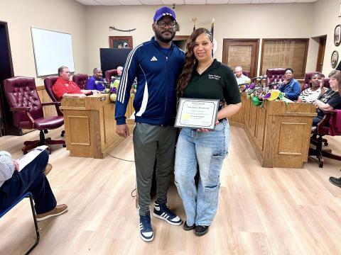 Jail Supervisor Haley Gallow (right) was recognized for achieving her State Food Safety Certification. She is pictured with City Councilman Bryant Riggs (left). (Photo courtesy of Ville Platte Police Department)