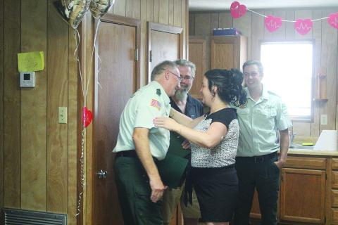 Katrina Hackney (front right) greets Paramedic Mark Dupont (front left) during a patient reunion held Tuesday, August 26. Also pictured are Paramedic Dustin Soileau (back right) and Hackney’s husband, Rusty (back left). (Gazette photo by Tony Marks)