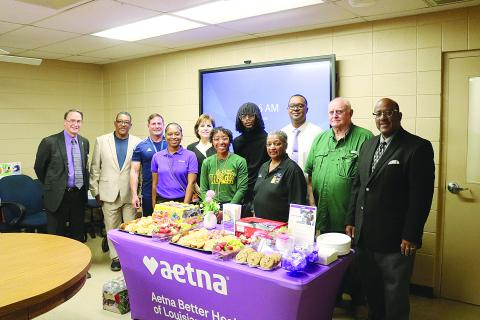 From left are (back row) Assistant Superintendent Mike Lombas, Roy Serie, Eric Fontenot, Ann Kay Logarbo, Torren LaFleur, Tommy Jones, School Board President Bobby Hamlin, and Superintendent Darwan Lazard; (front row) Amber McCoy, Maegan Moore, and School Board Vice President Sheila Joseph. (Gazette photo by Tony Marks)