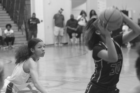 Mamou’s Cadence Young (4) watches as J.S. Clark’s Shanna Simien (30) attempts a basket in the girls’ inaugural Evangeline Parish All-Star game. (Gazette photo by Rhett Manuel)