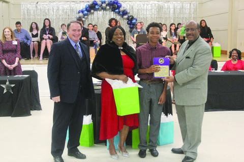 From left in the main photo are Evangeline Parish Assistant Superintendent of Schools Michael Lombas; Evangeline Parish School Board Vice President Wanda Skinner; Evangeline Parish 8th Grade Student of the Year Jayden Ardoin, of Ville Platte High; and Evangeline Parish Superintendent of Schools Darwan Lazard. (Gazette photo by Tony Marks)