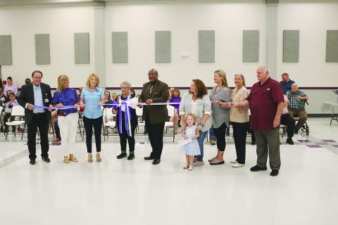From left are Assistant Superintendent Mike Lombas, Bayou Chicot Elementary Principal Kim Soileau, State Senator Heather Cloud, former Evangeline Parish School Board Member Peggy Forman, Superintendent Darwan Lazard, Cyndi Forman with Skylar Forman, Danni O’Neill, Evangeline Parish School Board Member Monica Andrus, and Evangeline Parish School Board President Bobby Hamlin. (Gazette photo by Tony Marks)