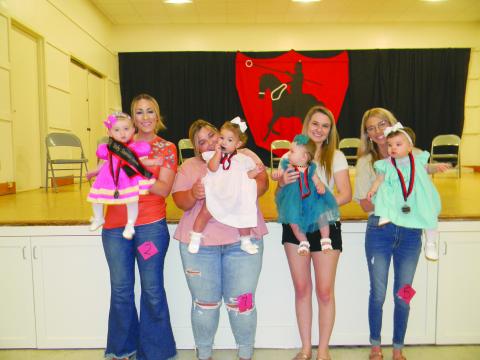 BABY MISS TOURNOI COURT - Shown, from left, are the members of the Baby Miss Tournoi Court. They are Queen Josie James Fletcher; Ella Grace Dupre, first runner-up; Vivian Aluss Orlando, second runner-up; and Vivienne Jane Brown, third runner-up.