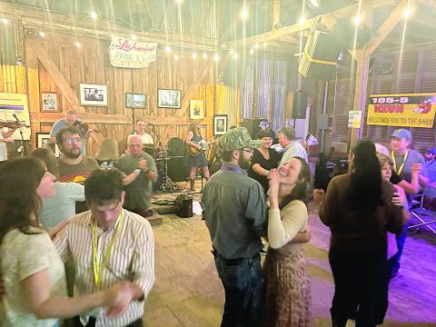 Participants and other guests dance to the band Balfa Toujours during the opening night of Dewey Balfa Cajun and Creole Heritage Week at Lakeview Park and Beach on Tuesday, March 25. Band member Christine Balfa is the daughter of Dewey Balfa. (Gazette photo by Tony Marks)