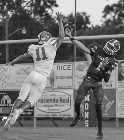 Bearcat defender Landon Istre (11) attempts to block a pass by Mamou’s quarterback Jayden Ardoin (1) during last Friday’s exciting cross-parish gridiron contest.  (Photo by Tonya Ortego)