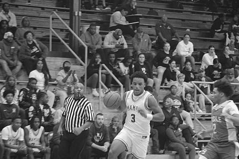 Mamou’s Zamaurri Brown (3) drives toward the goal in a game against Basile during the parish basketball tournament at Sacred Heart. (Gazette photo by Tony Marks)