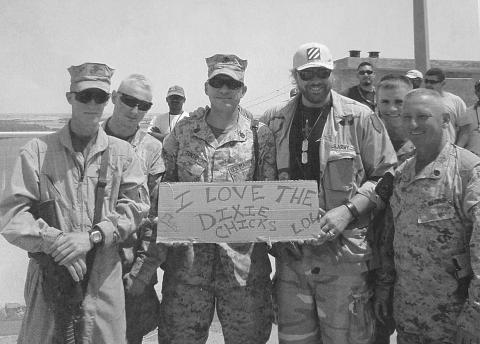 Basile’s Ben Fontenot (center) with Toby Keith (right) in Iraq in 2006.