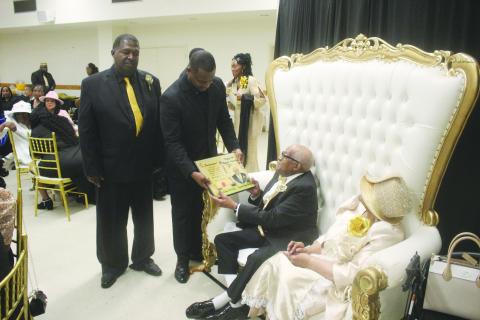 On behalf of the Evangeline Parish Police Jury, Jurors Daniel Arvie (standing left) and Darion Arvie (standing right) present a proclamation to Pastor Eradly Ben Sr. (seated left) and First Lady Lois Ben (seated right) in recognition for their 50 years of ministry to Antioch Baptist Church. (Gazette photo by Tony Marks)