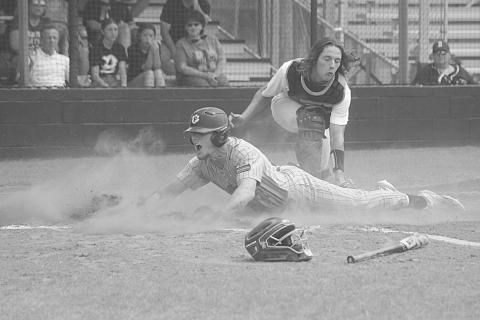 Caden Askey (7) slides underneath a tag to score Pine Prairie’s second run in the top of the first inning in Game 3 against Berwick on Saturday. (Gazette photo by Tony Marks)