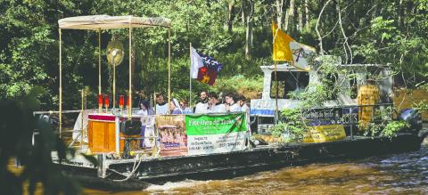 A boat carrying the Blessed Sacrament processes down the Bayou Teche during a previous Fête-Dieu du Teche. (Submitted photo)