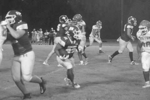 Sheamus Frank (23) runs 15 yards for a Mamou touchdown with 4:52 remaining in the first quarter against Bolton Academy. (Gazette photo by Tony Marks)