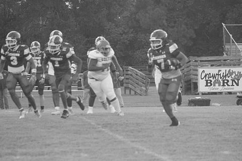 Keontez Campbell (7) scores a 42-yard touchdown against Bolton Academy to begin the regular season. (Gazette photo by Tony Marks)