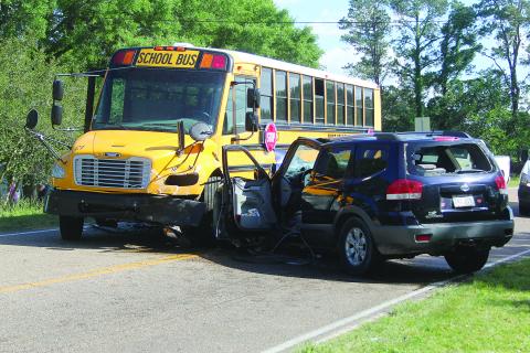 SUV collides with school bus