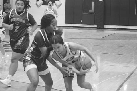 Riley St. Cyr (34) holds on to the basketball on her way to the net in Sacred Heart’s come-from-behind win against Beau Chene.