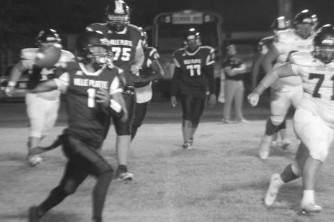 Bulldog quarterback Jaquan Lavergne (1) looks to complete a pass against Church Point on Thursday night. Lavergne and the other seniors were honored during the course of the evening. (Gazette photo by Rhett Manuel)