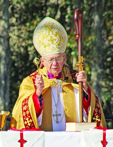 Bishop J. Douglas Deshotel of the Diocese of Lafayette blesses the three copies of the Acts of the Cause for the canonization.  (LSN photo by Claudette Olivier)