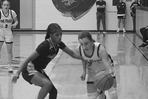 Pine Prairie’s Jolie Redmon (10) tries to maintain possession of the basketball against Church Point. She led the Lady Panthers with 7 points in a 47-10 loss. (Gazette photo by Tony Marks)